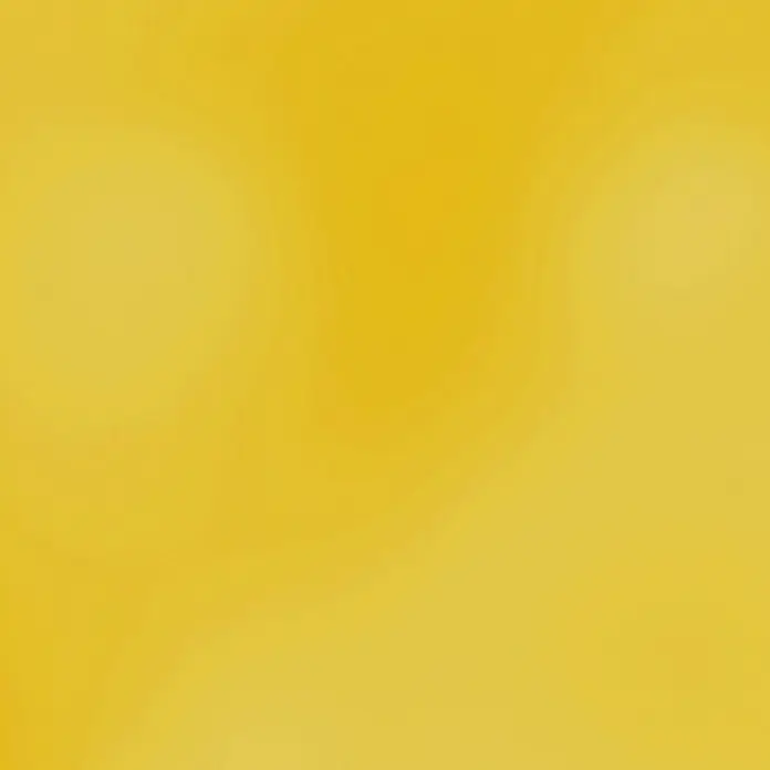 Fleur Colorante líquido para resina - Dorado, 10 ml - Fondo borroso en un tono amarillo cálido. Ideal para transiciones suaves y sutiles toques de color en diseño gráfico y presentaciones.