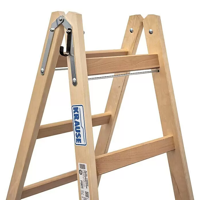 Krause Stabilo Escalera doble - Número de peldaños: 12 ud., Altura de trabajo: 3 m, Madera - Escalera de madera marrón claro con bisagras metálicas, una varilla de metal y un gancho para herramientas. Una etiqueta KRAUSE es visible.