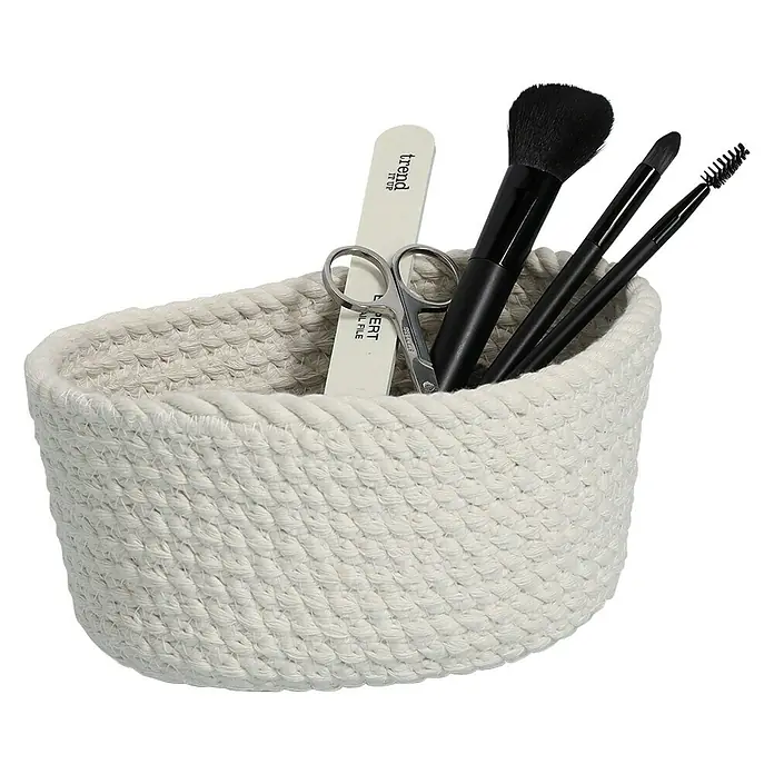 Zeller Present Juego de cestas trenzadas - Blanco, 3 pzs. - Cesta ovalada de cuerda con herramientas de maquillaje, incluyendo pinceles, lima de uñas y tijeras, ideal para organizar cosméticos.