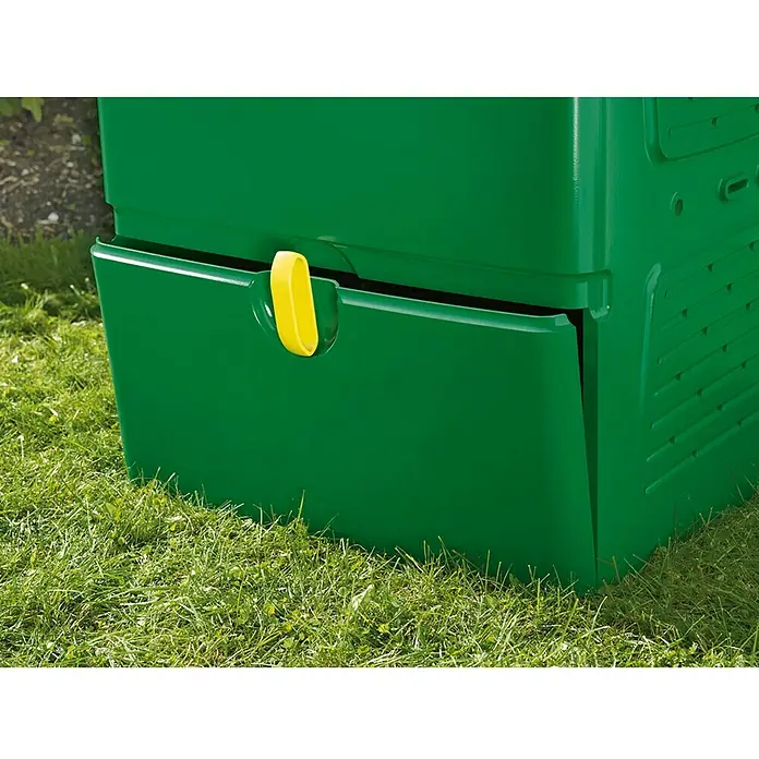 Juwel Aeroplus Komposter 6000 - 600 l, 79 x 79 x 110 cm - Nahaufnahme einer grünen Biokompostbox im Freien mit gelbem Griff. Ideal für Gartenabfälle und umweltfreundliche Kompostierung.