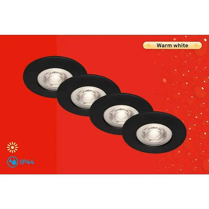 Briloner Set de focos LED empotrables redondos Kulana - 20 W, Ø x Al: 9 x 2,5 cm, 4 ud., Blanco cálido, Negro - La imagen muestra un primer plano de cuatro focos LED empotrables negros que emiten una luz blanca cálida, mostrando una solución de iluminación elegante.