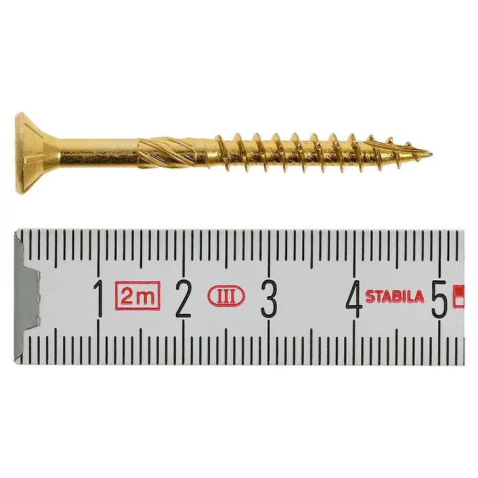 Profi Depot Mehrzweck-Schraube Turbo Drill - Ø x L: 5 x 50 mm, TX für TORX-Antriebe, Senkkopf, 100 Stk. - Nahaufnahme einer goldenen Schraube neben einem Zollstock zur Größenbestimmung. Die Schraube ist etwa 4-5 cm lang.