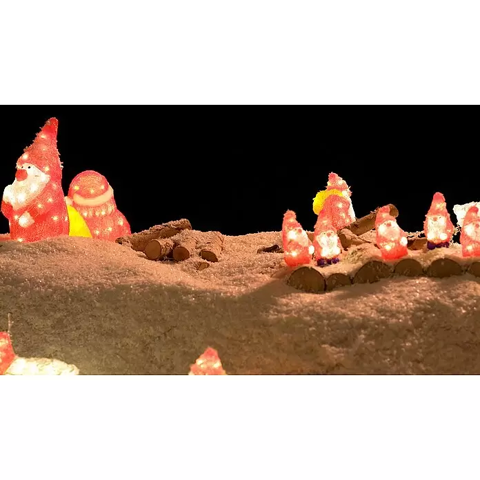 Konstsmide LED-Weihnachtsdekofigur - 18 x 19 x 38 cm, Rot, Weiß, Netzbetrieben, LED - Beleuchtete rote Wichtelfiguren und schneebedeckte Holzscheite in einer festlichen Winterszene auf Kunstschnee.