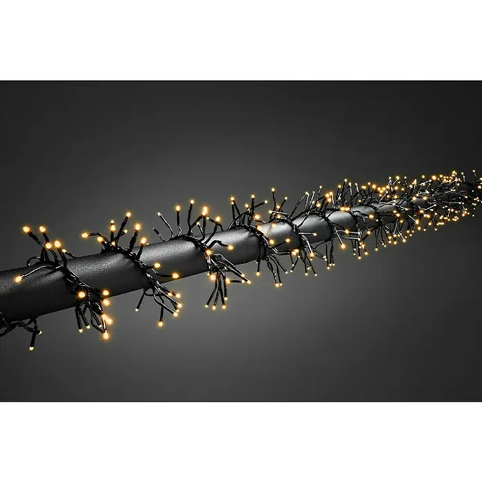 Konstsmide LED-Clusterlichterkette - Außen, Länge: 13,6 m, 1.152 Stk., Netzbetrieben - LED-Lichterkette um einen grauen Stab gewickelt. Die Lichterkette leuchtet warmweiß und sorgt für eine festliche Atmosphäre.