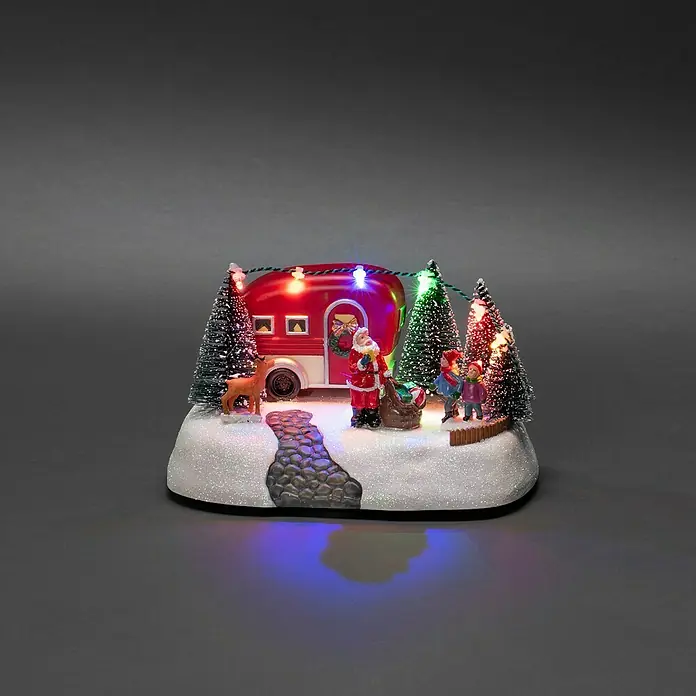 Konstsmide LED-Szenerie Wohnwagen - L x B x H: 13 x 18,5 x 10,5 cm, Mehrfarbig, Batteriebetrieben, LED - Ein festliches, beleuchtetes Weihnachtsdiorama mit einem Wohnwagen, Santa und Kindern, das Urlaubsstimmung verbreitet.
