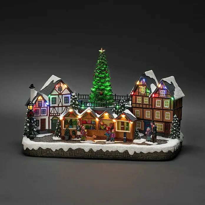 Konstsmide LED-Szenerie Weihnachtsmarkt - L x B x H: 39 x 20,5 x 23,5 cm, Mehrfarbig, Netzbetrieben, LED - Winterliches Miniatur-Weihnachtsdorf mit festlicher Beleuchtung und detailreichen Häusern, Buden und Figuren auf einer Schneelandschaft.