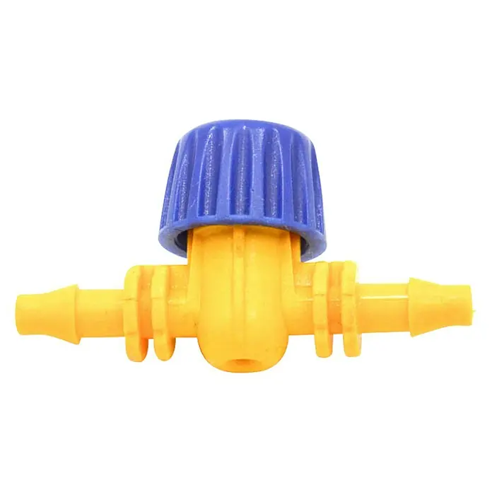 Llave de paso - 4 mm, Específico para: Microtubo de sistemas de riego por goteo - Primer plano de una válvula de riego de plástico amarilla con mango azul sobre fondo negro.