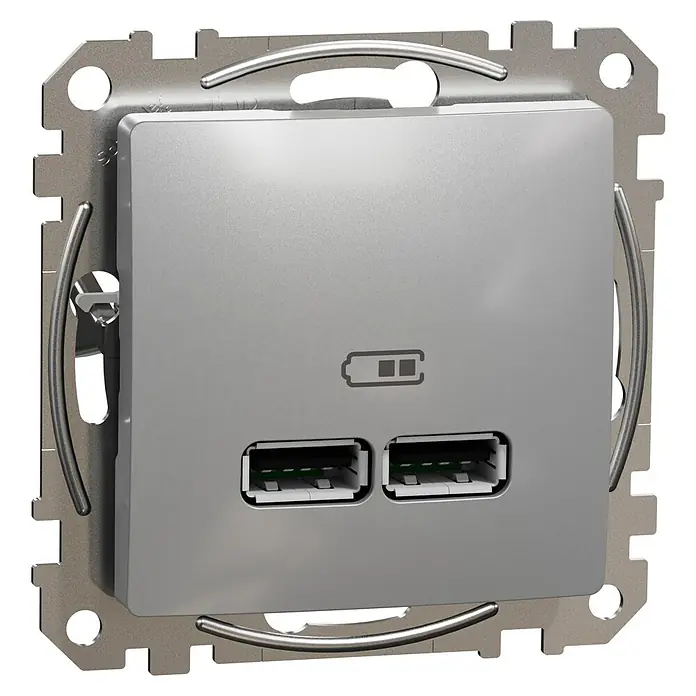 Schneider Electric Sedna Design & Elements Toma USB 2 X A - Aluminio, x 2, Plástico, Colocar - Primer plano de un enchufe USB de pared plateado con dos puertos USB y un símbolo de batería, encajado en un soporte de montaje metálico.