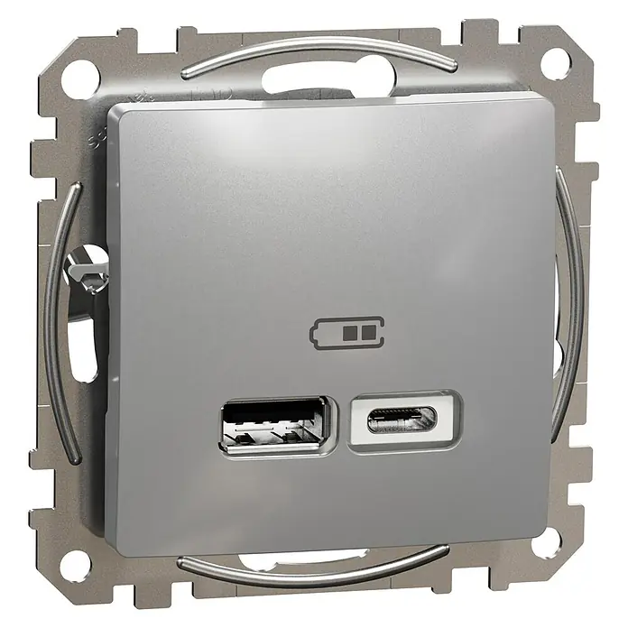 Schneider Electric Sedna Design & Elements Toma USB Tipo A y C - Aluminio, x 2, Plástico, Instalar - Primer plano de una toma de pared USB doble plateada con puertos USB-A y USB-C, y un indicador de batería.