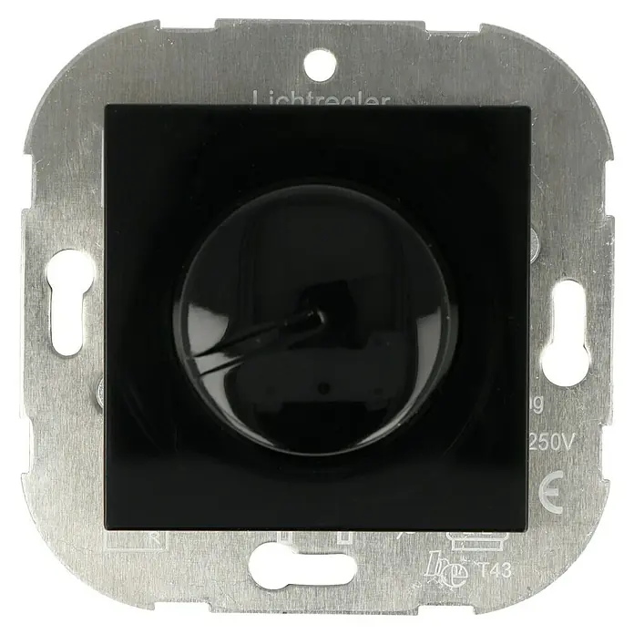 Voltomat ART Dimmer Konventionell - Schwarz, Kunststoff - Nahaufnahme eines Lichtreglers mit schwarzer Abdeckung und metallener Umrandung, der für eine Spannung von 250V geeignet ist.