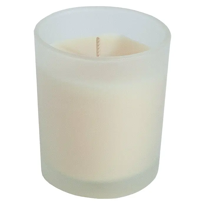 Ceras Roura Vaso con vela - Ø x Al: 7 x 8,5 cm, Vainilla - Primer plano de una vela perfumada blanca sin encender en un recipiente de vidrio translúcido con una mecha gruesa.
