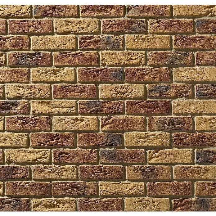 Stegu Verblendstein-Ecke Country 610 - 20,5 cm x 9,5 cm x 14 mm, Braun/Beige, Steinoptik - Nahaufnahme einer rustikalen Backsteinmauer mit warmen Braun- und Gelbtönen, die eine Textur und Tiefe zeigt.