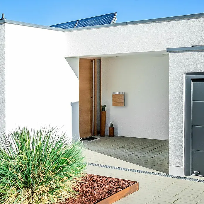 Metzler Wandbriefkasten Masiva - L x B x H: 11,2 x 33 x 35 cm, Braun/Silber, Edelstahl - Moderne Hausfassade mit einem stilvollen Briefkasten aus Holz und Metall. Der Briefkasten ist ein echter Hingucker und passt perfekt zum modernen Design.