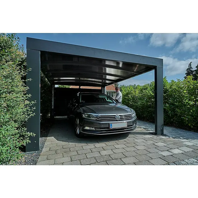 Allview Carport Calux - Außenmaß inkl. Dachüberstand (B x T): 3,7 x 5,8 m, Grau - Das Bild zeigt ein modernes Carport aus dunklem Metall mit einem geparkten grauen PKW darunter, umgeben von üppigem Grün.