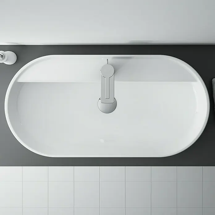 Inspira Aufsatzwaschbecken - 81 x 41 cm, Weiß - Draufsicht auf ein ovales, weißes Waschbecken mit Armatur und Fliesenboden, ideal für ein modernes Badezimmerdesign.