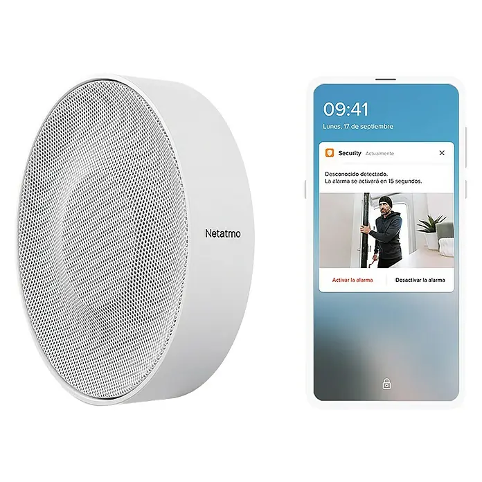 Netatmo Sirena interior - Específico para: Cámara Interior Inteligente Netatmo - La imagen muestra un sistema de seguridad Netatmo con una cámara de vigilancia redonda y un smartphone que muestra una alerta de seguridad.