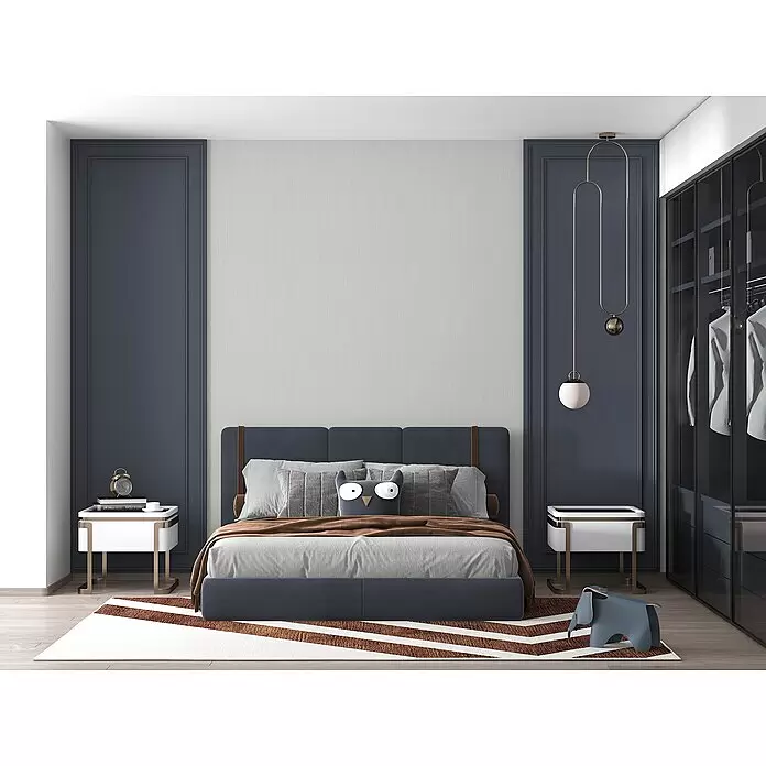 Marburg Modernista Vliestapete - Grau, Uni, 10,05 x 0,53 m - Ein modernes Schlafzimmer mit einem blau gepolsterten Bett, grauer Bettwäsche, modernen weißen Nachttischen und einem gemusterten Teppich.