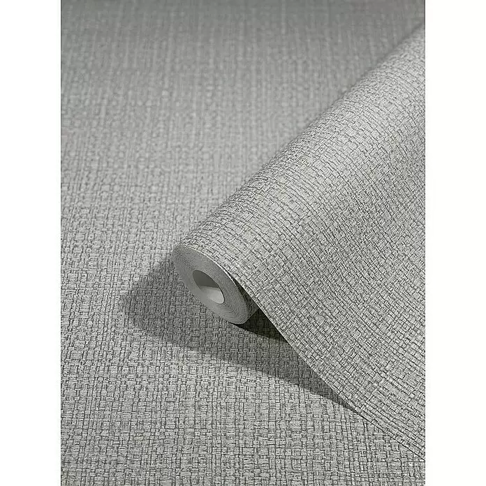 Marburg Vintage Deluxe Vliestapete Retro - Grau-Silber, Uni, 10,05 x 0,53 m - Hellgraue, texturierte Tapetenrolle mit gewebtem Muster, teilweise abgerollt zur Präsentation des Designs.