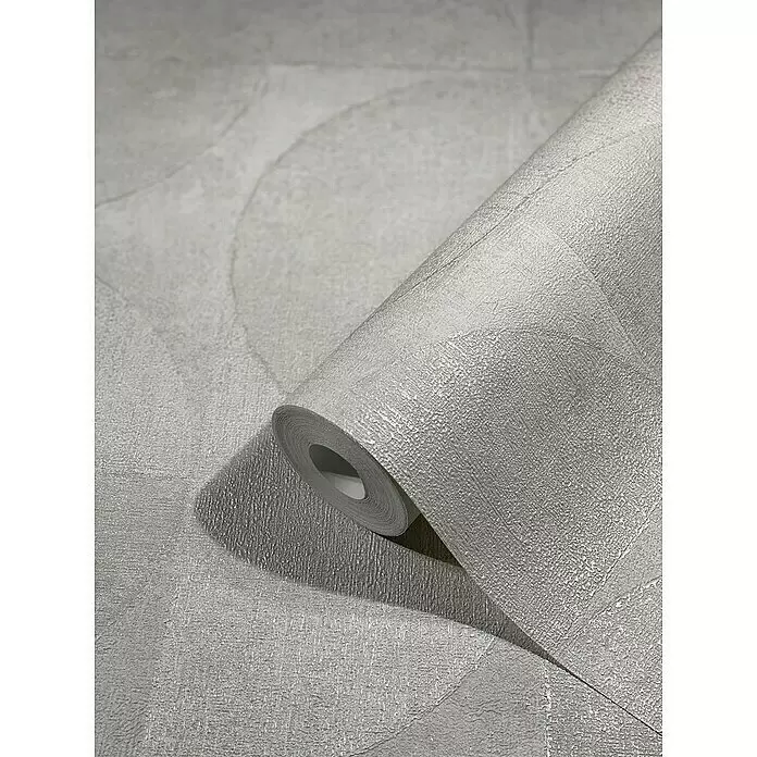 Marburg Vintage Deluxe Vliestapete - Pearl, Grafisch, 10,05 x 0,53 m - Teilweise abgerollte, hellgraue strukturierte Tapetenrolle mit subtilen kreisförmigen Mustern.