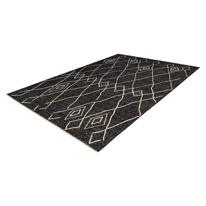 Kurzflorteppich Agadir - Graphit, 150 x 80 cm, 100% Polypropylen (Flor) - Ein rechteckiger Teppich mit einem markanten geometrischen Muster in Weiß auf einem dunklen Untergrund.