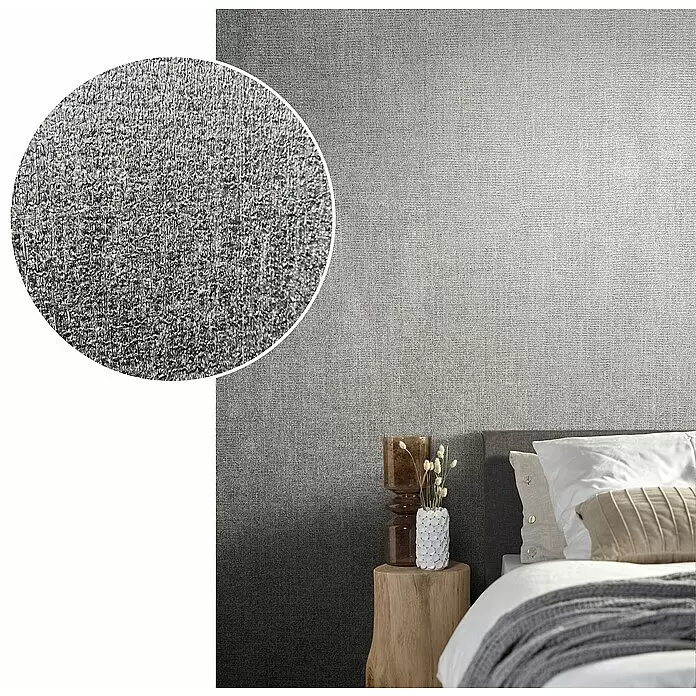 Marburg Natural Opulence Vliestapete - Grau-Grün, Uni, 10,05 x 0,7 m - Texturierte Tapete mit Farbverlauf von Silber zu Dunkelgrau, an einer Schlafzimmerwand.