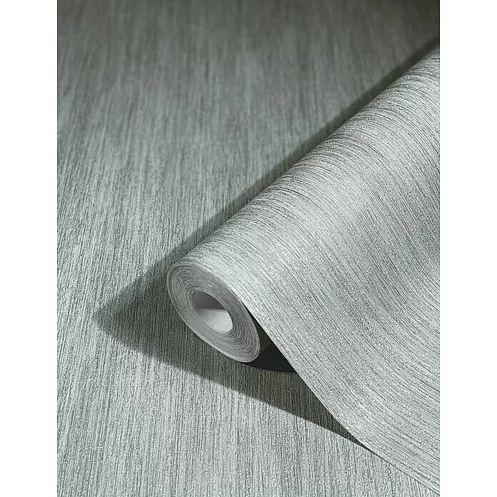 Marburg Natural Opulence Vliestapete - Metallic-Grau, Streifen, 10,05 x 0,7 m - Rolle hellsilberner Tapete mit feinem vertikalem Strukturlmuster, teilweise abgerollt.