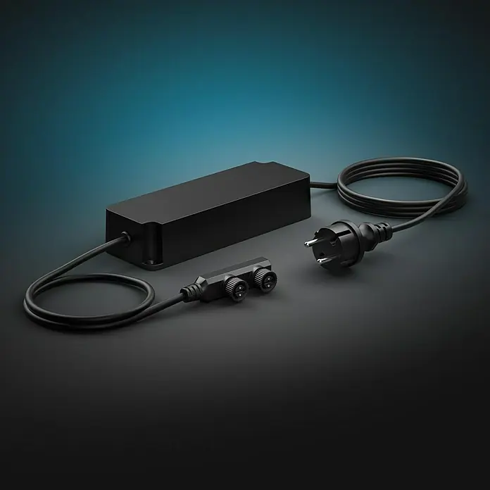 Philips Hue Netzteil Outdoor - Max. Leistung: 100 W, Schwarz, L x B x H: 20 x 7 x 4,5 cm - Schwarzes elektronisches Vorschaltgerät mit Kabel und Stecker. Netzteil und Stecker sind für den Betrieb elektronischer Geräte ausgelegt.