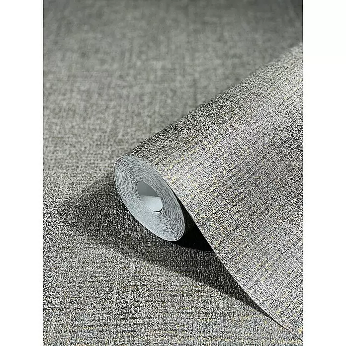Marburg Natural Opulence Vliestapete - Grau-Silber, Uni, 10,05 x 0,7 m - Strukturierte graue Tapetenrolle mit goldenen Sprenkeln, teilweise abgerollt, um ihr Webmuster zu zeigen.