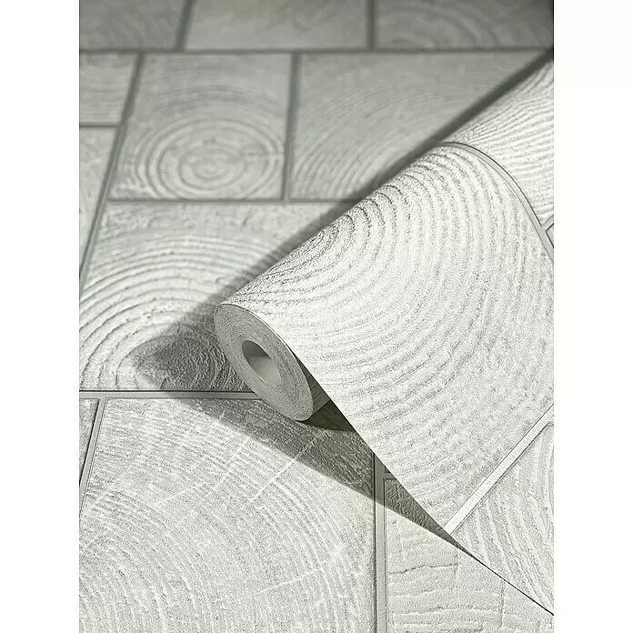 Marburg Natural Opulence Vliestapete - Weiß-Grau, Holzoptik, 10,05 x 0,7 m - Teilweise abgerollte hellgraue Tapete mit deutlichem Holzblock- und Jahresringmuster.