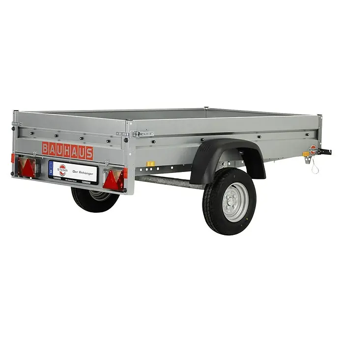Stema Anhänger BH 7.5-20-12.1B mit Bordwandaufsatz u. Flachplane - Nutzlast: 583 kg, Einachser, Kasteninnenmaß: 201 x 117 x 60 cm, Ungebremst - Ein silberner, einachsiger Anhänger von Bauhaus mit dem Stema-Logo, ideal für den Transport von Gütern.