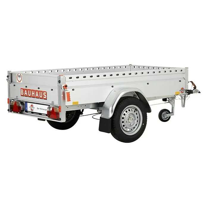 Stema Anhänger BH-R 850 - Nutzlast: 685 kg, Einachser, Kasteninnenmaß: 201 x 108 x 33 cm, Gebremst - Das Bild zeigt einen silbernen BAUHAUS Anhänger mit einem Rad und der Aufschrift "BAUHAUS" auf der Seite. Der Anhänger steht auf einem ebenen Untergrund.