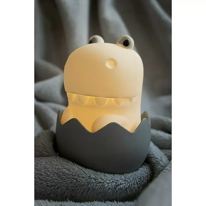 MegaLight LED-Nachtlicht DIGGY DINO - Weiß/Grau/Grün, L x B x H: 11 x 8 x 13 cm, RGBW, DIGGY DINO - Leuchtendes Dinosaurier-Nachtlicht mit großen Augen, das aus einer grauen Eierschale schlüpft.