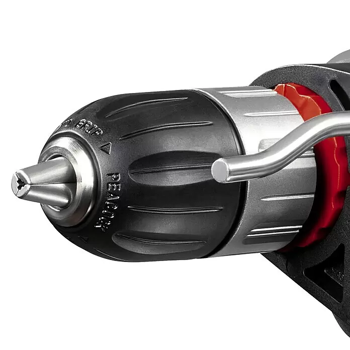 Einhell Taladro percutor TC-ID 1000 E Kit - 1.010 W, Portabrocas de sujeción rápida - Primer plano del portabrocas de taladro con empuñadura negra, mordazas plateadas con broca de estrella, acento rojo y asa lateral plateada.
