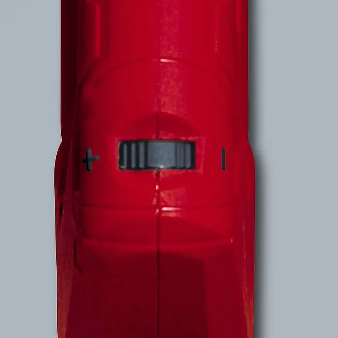 Einhell Wand- & Deckenschleifer TC-DW 225 - 600 W, Durchmesser Schleifscheibe: 225 mm - Nahaufnahme eines roten Akku-Schraubers mit einem Drehknopf zur Einstellung der Drehrichtung, gekennzeichnet mit Plus- und Minuszeichen.