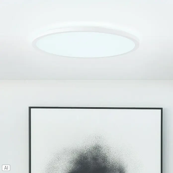 Brilliant LED-Deckenleuchte rund Tanida - 24 W, Ø x H: 42 x 2,5 cm, Weiß, Neutralweiß - Nahaufnahme einer modernen, runden Deckenleuchte in Weiß, die ein helles, gleichmäßiges Licht abstrahlt und für eine stilvolle Beleuchtung sorgt.