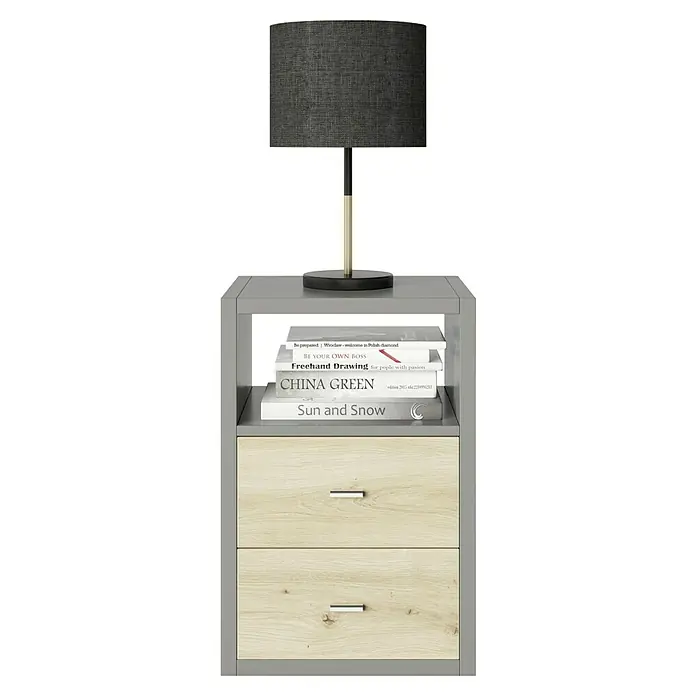 Phönix Fortuna Beistelltisch - L x B x H: 34 x 58 x 39,2 cm, Grau, Mit Schubladeneinsatz - Ein grauer Nachttisch mit zwei Schubladen, einer Lampe und einem Stapel Bücher darauf, ideal für Schlafzimmer.