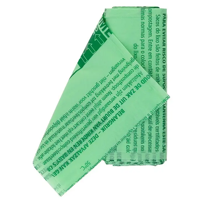 Brabantia Bolsas de basura Biodegradables - 6 l, 10 ud., Verde - Toma de rollo de bolsas de basura compostables que muestran etiquetas de advertencia en varios idiomas.