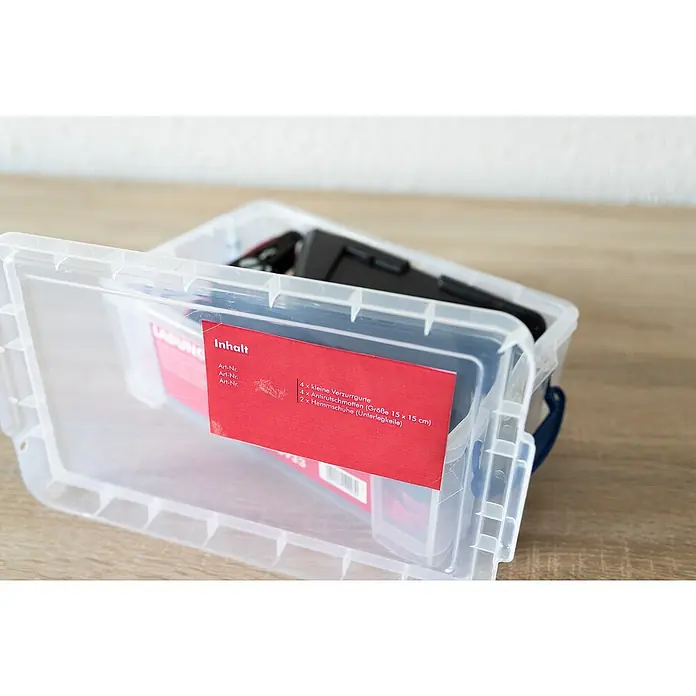 Stema Ladungssicherungs-Set bis LC 400 daN - 10 -tlg. - Transparente Aufbewahrungsbox mit rotem Inhaltszettel, gefüllt mit Spanngurten und Antirutschmatten.