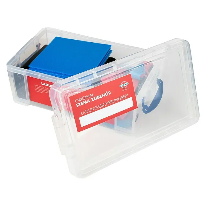 Stema Ladungssicherungs-Set bis LC 400 daN - 10 -tlg. - Ein durchsichtiger Kunststoffbehälter mit einem 'Stema Ladungssicherung Set' Etikett, gefüllt mit blauen und schwarzen Blöcken.