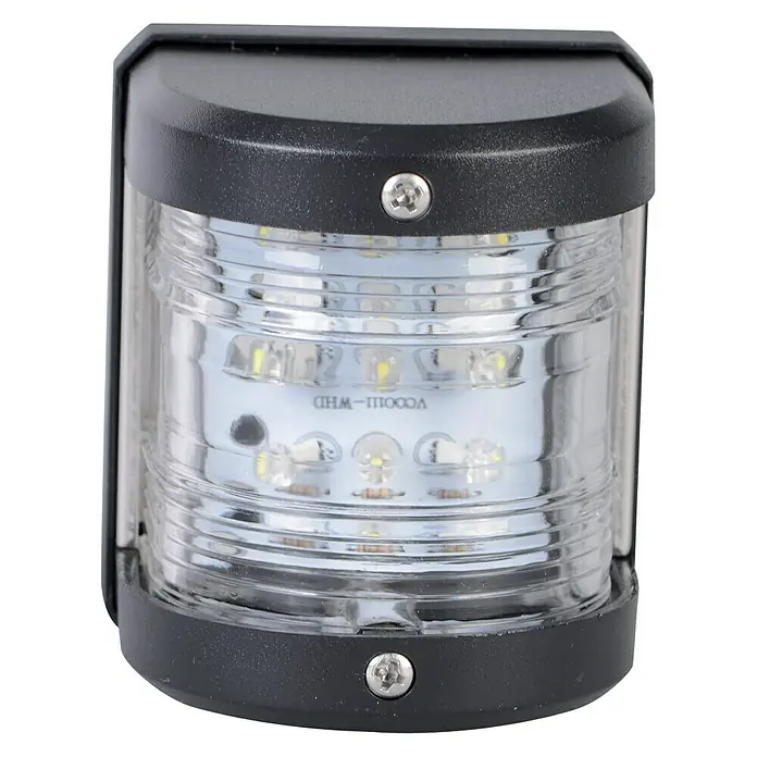 Talamex LED-Topplaterne - 55,5 x 64,4 x 75 mm, 12 V, 0,54 W, Schwarz, Lichtfarbe: Neutralweiß - Nahaufnahme einer schwarzen Boots-Heckleuchte mit klarem Gehäuse und LED-Leuchtmitteln.