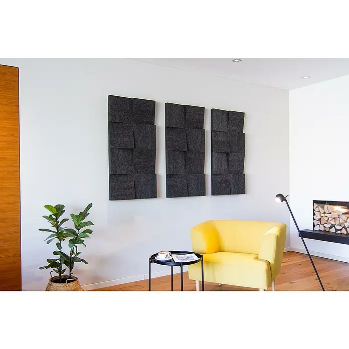 Silenti Akustikpaneel Slope - Anthrazit, 116 cm x 58 cm x 80 mm, 100 % Polyester - Schallabsorbierende Wandpaneele in Anthrazit an einer weißen Wand, die für eine verbesserte Akustik und ein modernes Design sorgen.