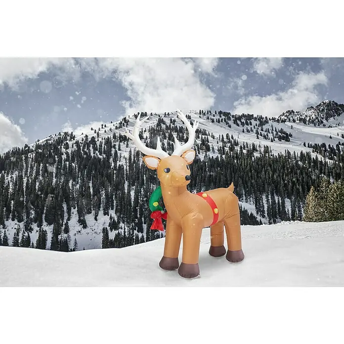 Figura LED navideña Reno - 175 x 56 x 213 cm, Multicolor, Funcionamiento en red, LED - Reno inflable con astas y una corona navideña en la nieve con un fondo de montaña nevada.