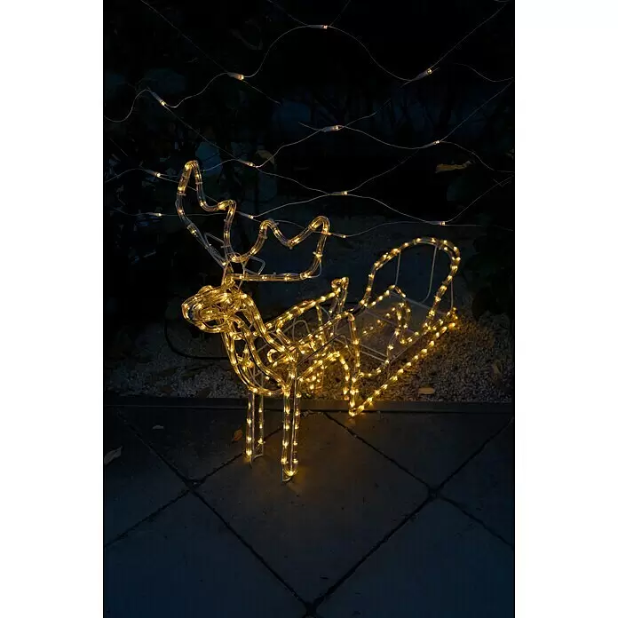 Tween Light LED-Lichtschlauch Rentier mit Schlitten - Anwendungsbereich: Außen, Warmweiß - Beleuchtete Rentier- und Schlittendekoration mit warmweißen LEDs, leuchtend im Freien bei Nacht.