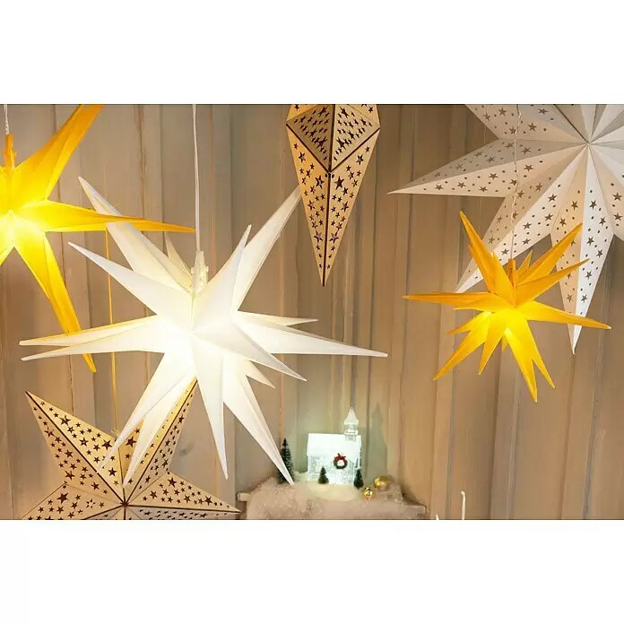 Tween Light Estrella LED colgante 3D - 100 cm, Blanco, Color de luz: Blanco cálido, IP44, Funcionamiento en red - Lámparas y decoraciones colgantes en forma de estrella amarillas, blancas y de madera, creando un ambiente festivo iluminado.