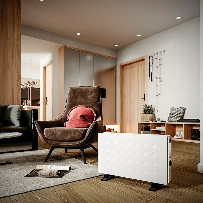 Voltomat HEATING Konvektorheizung Dubbe - 2.000 W, Raumgröße bis ca. 20 m², Weiß - Ein moderner, weißer Heizkörper steht auf einem Holzboden und sorgt für Wärme in einem stilvollen Wohnzimmer.