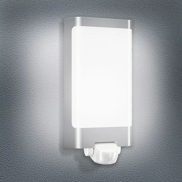 Steinel LED-Sensor-Außenwandleuchte L 240 S Edelstahl - 9,3 W, L x B x H: 8,1 x 16,5 x 30,5 cm, Weiß/Edelstahl, Warmweiß - Die LED-Wandleuchte mit Bewegungsmelder sorgt für Sicherheit. Das Licht schaltet sich bei Bewegung ein und bietet Orientierung im Dunkeln.