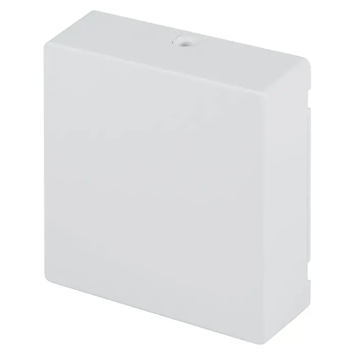 Homematic IP Funk-Schaltermodul HmIP-MOD-HO - Passend für: Hörmann-Antriebe - Nahaufnahme einer weißen Aufputz-Installationsdose mit einer Bohrung in der Oberseite.