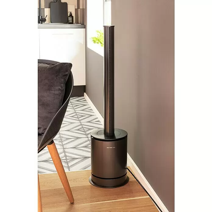Emerio Standventilator Luftreiniger und Heizlüfter 3in1 - Raumgröße bis ca. 20 m², Dunkelgrau, Höhe: 98,6 cm - Dunkelbronze emerio Turmventilator/Heizgerät in modernem Wohnraum, auf Holzboden neben Stuhl und grauer Wand.