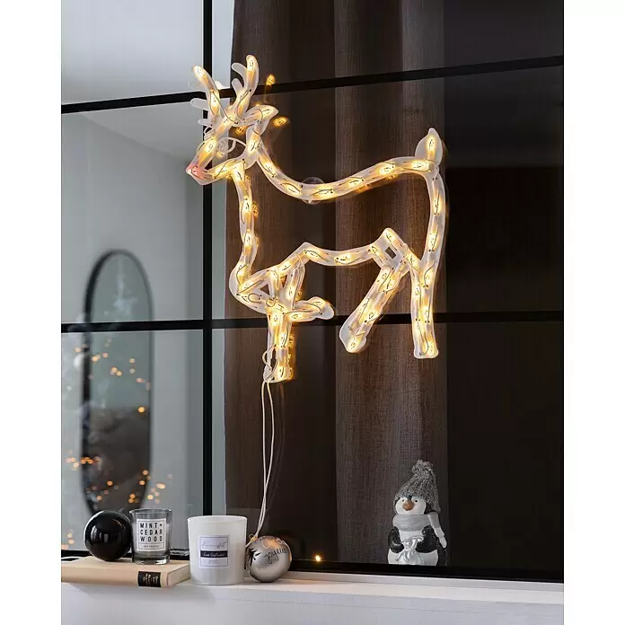 Konstsmide LED-Lichtschlauch Rentier - Warmweiß, IP20 - Weiße leuchtende Rentier-Dekoration mit warmweißen Lichtern, die an einem Fenster hängt.