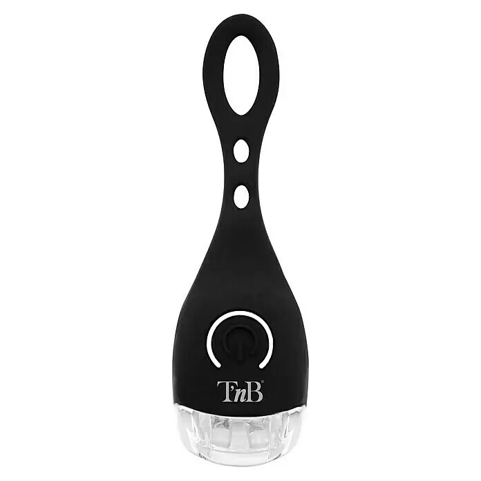 T'nB Linterna para bicicletas - Blanco - Luz portátil negra con base transparente, símbolo de encendido blanco y tres aberturas circulares.